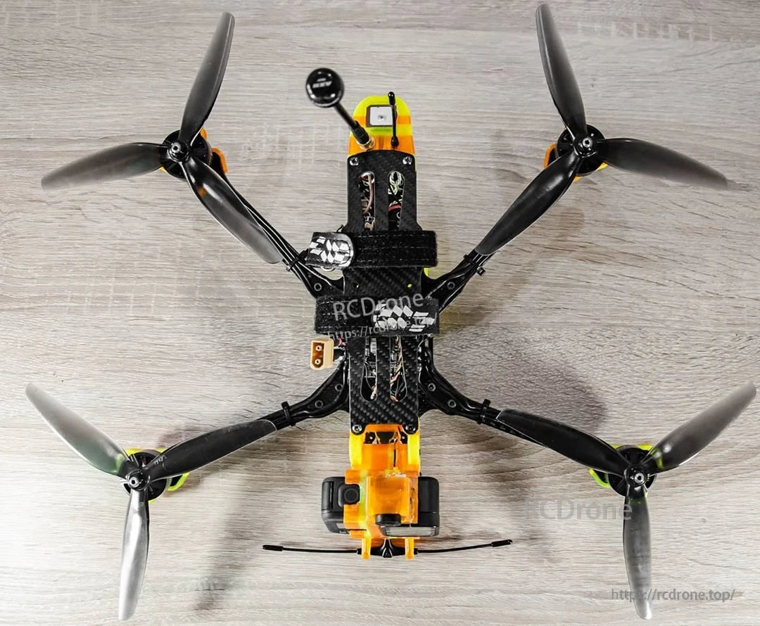 7-inch tri-blade propellers installed on an FPV quadcopter, top-down view showing all four rotors