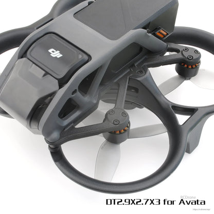 Close-up of DJI Avata drone with gray 3-blade propellers installed inside duct guards