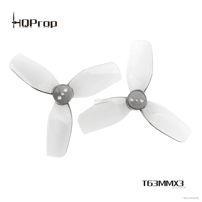 Pair of HQProp DT63MMX3 V2 63mm tri-blade propellers shown together, grey hub with translucent blades