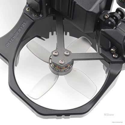 Light grey 4-blade propeller installed in a ducted cinewhoop frame, close-up of motor and hub