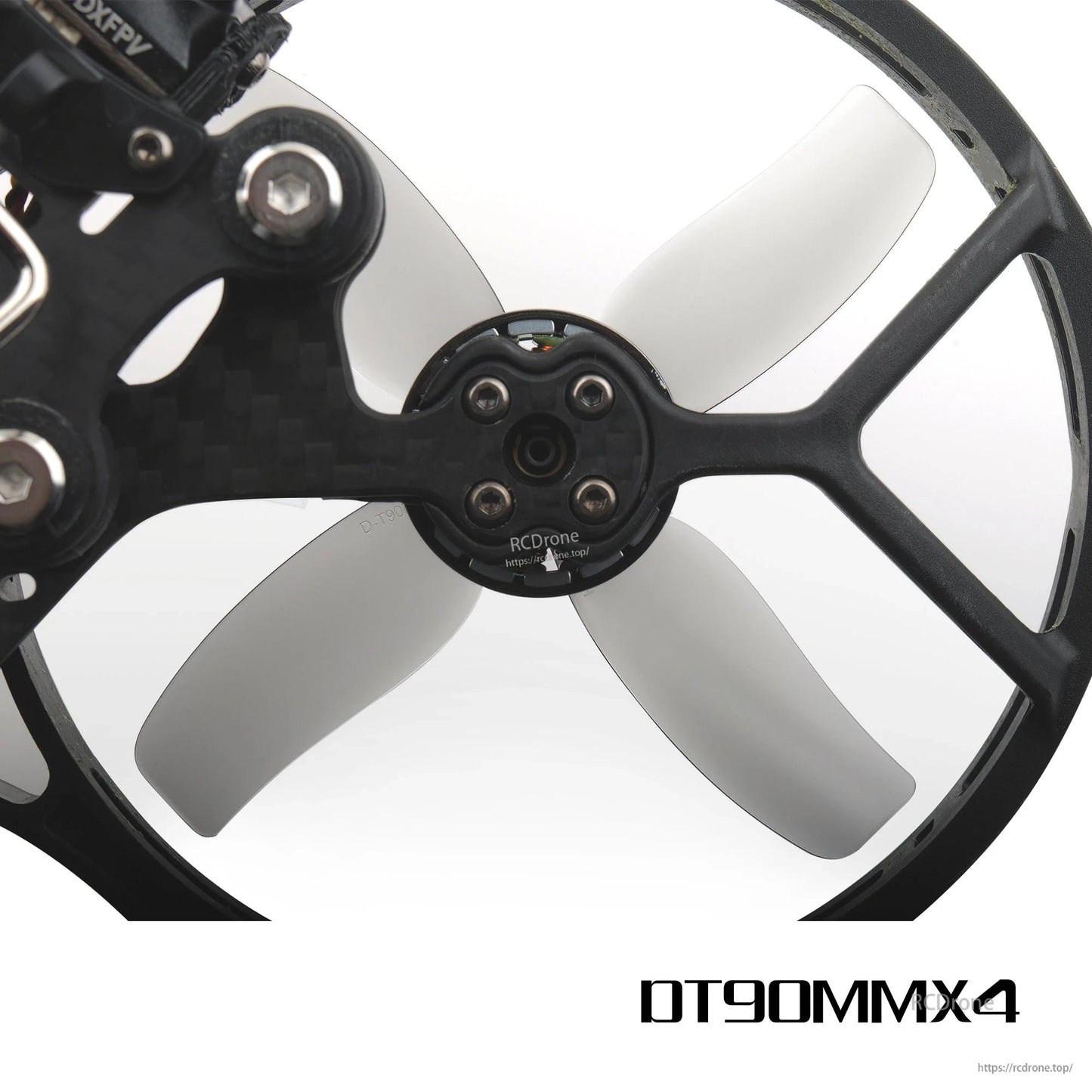 Grey 4-blade prop mounted in cinewhoop duct guard, hub and motor screw pattern close-up