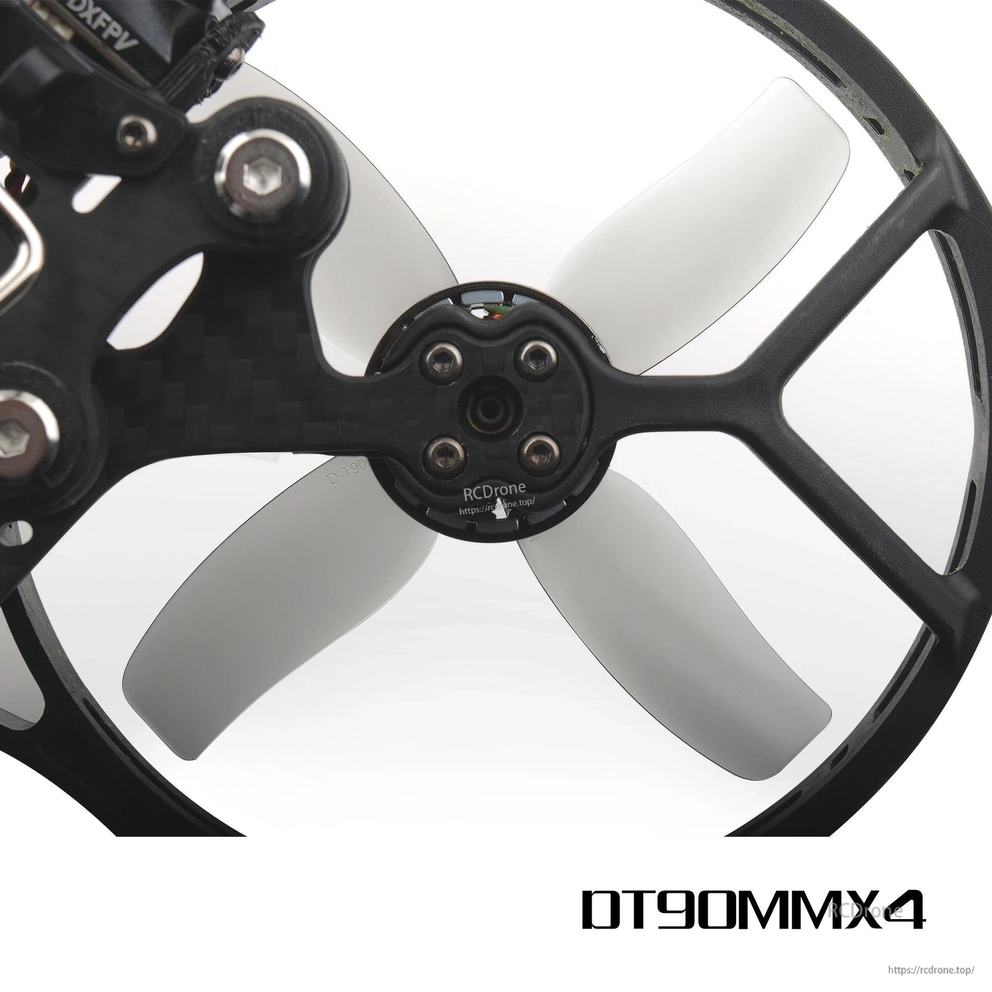 Grey 4-blade prop mounted in cinewhoop duct guard, hub and motor screw pattern close-up