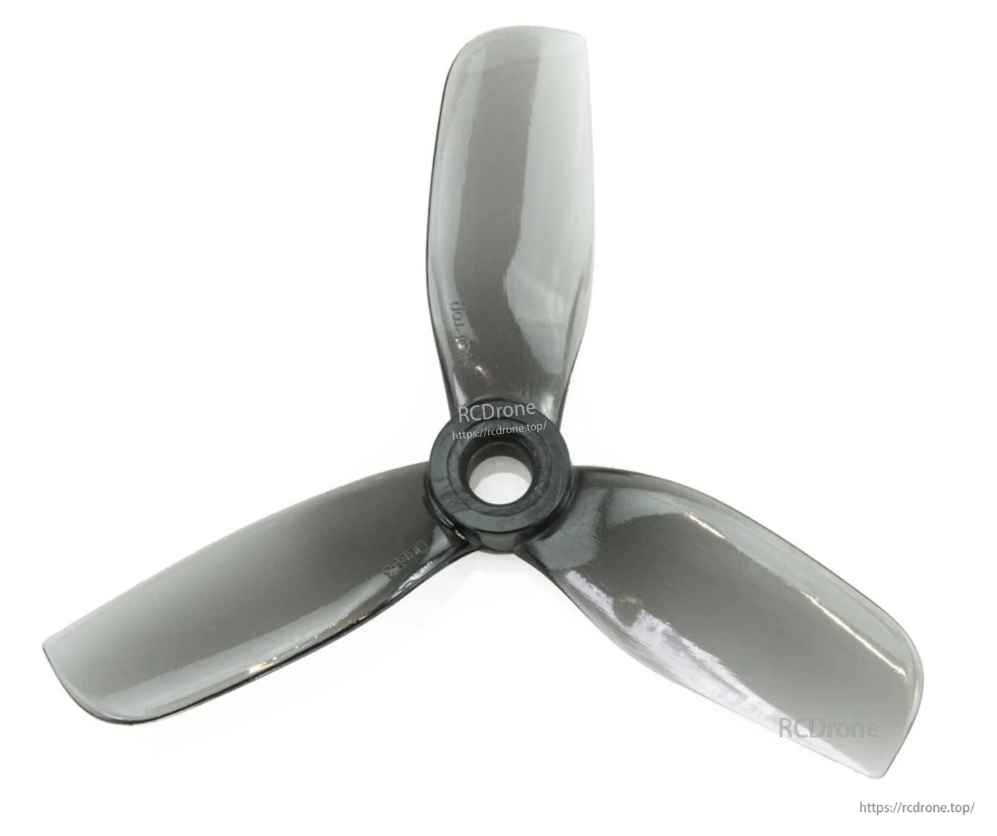 Smoke gray tri-blade propeller close-up with RCDRone watermark, centered hub and blade shape