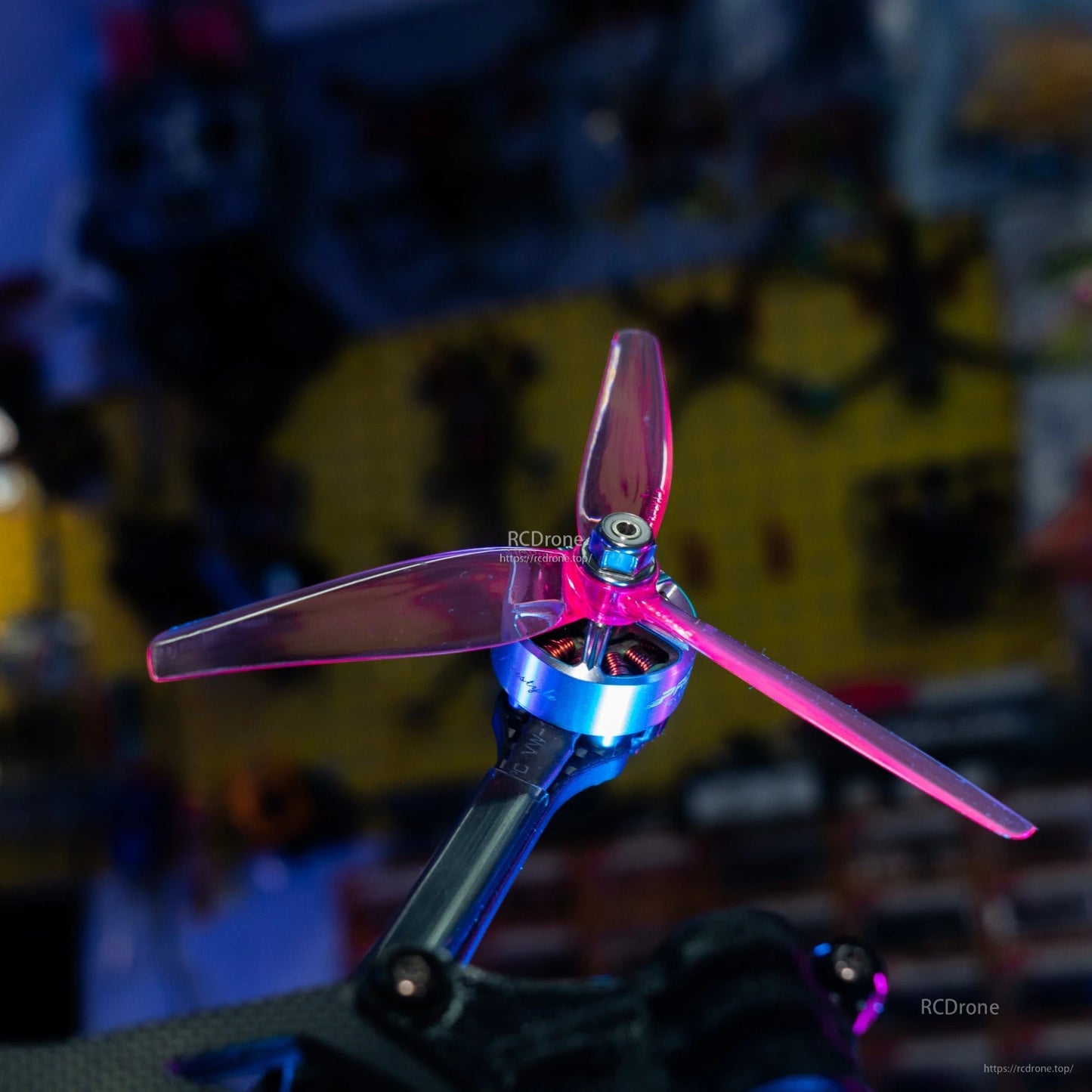 HQProp Ethix P3.5 RAD Berry tri-blade prop mounted on FPV motor, close-up of hub and blades