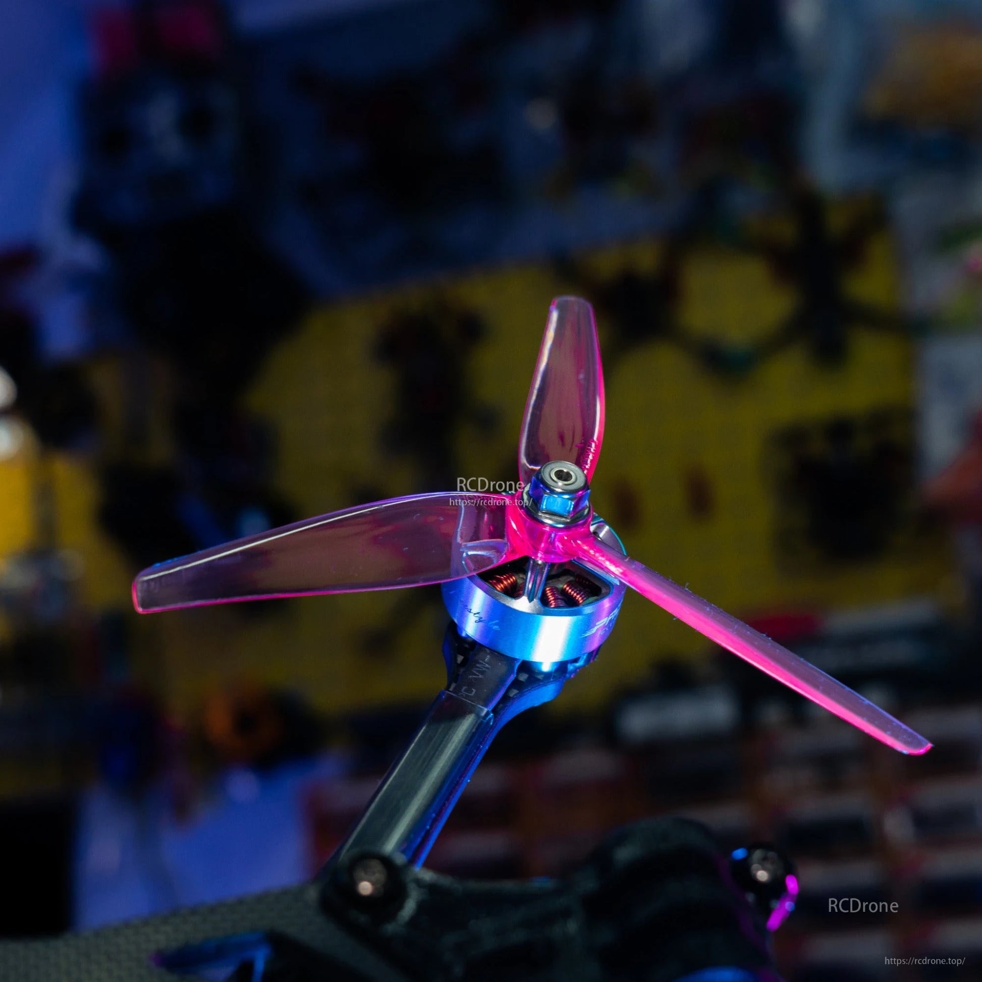 HQProp Ethix P3.5 RAD Berry tri-blade prop mounted on FPV motor, close-up of hub and blades