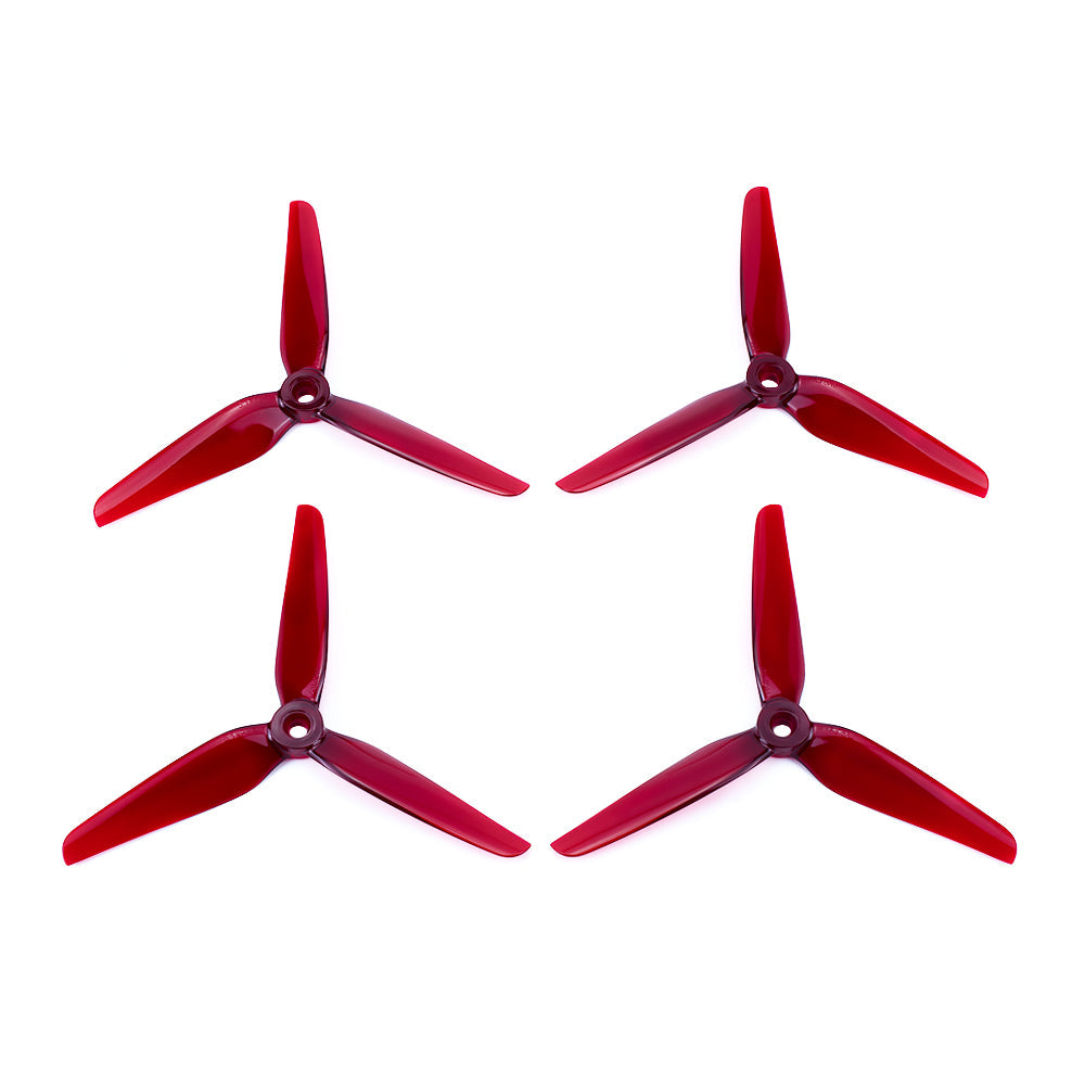 HQProp Manta 5 Pro FPV Propeller, Four red HQProp Manta 5 Pro tri-blade FPV drone propellers with a central mounting hole