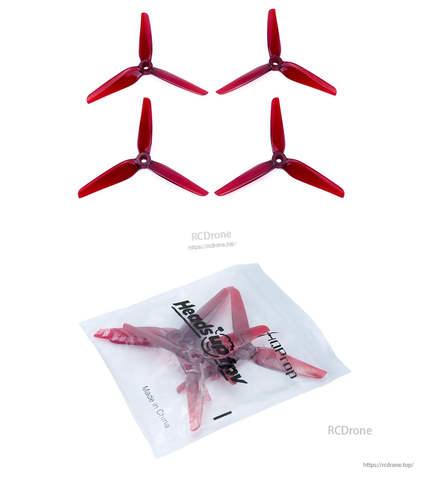 Red tri-blade HQProp Manta 5 Pro FPV propellers with a branded plastic bag for storage.