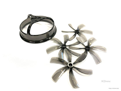 Four translucent 6-blade 85mm props with matching black duct shroud ring, angled view