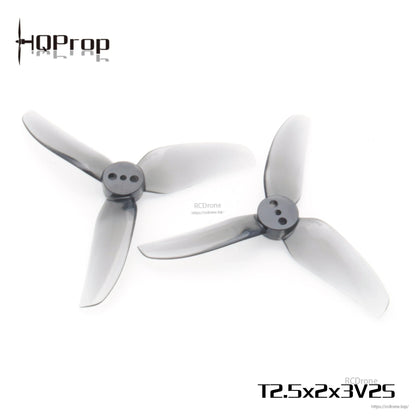 Pair of smoke-gray tri-blade propellers on white background, hub and blade shape view