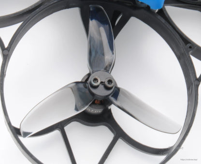 Close-up of smoke tri-blade propeller installed in a ducted whoop frame guard