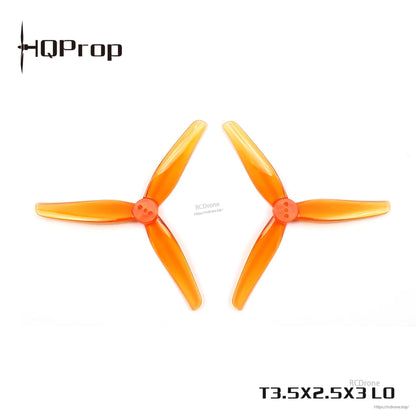 Two orange T3.5x2.5x3 LO 3-blade FPV propellers shown side by side