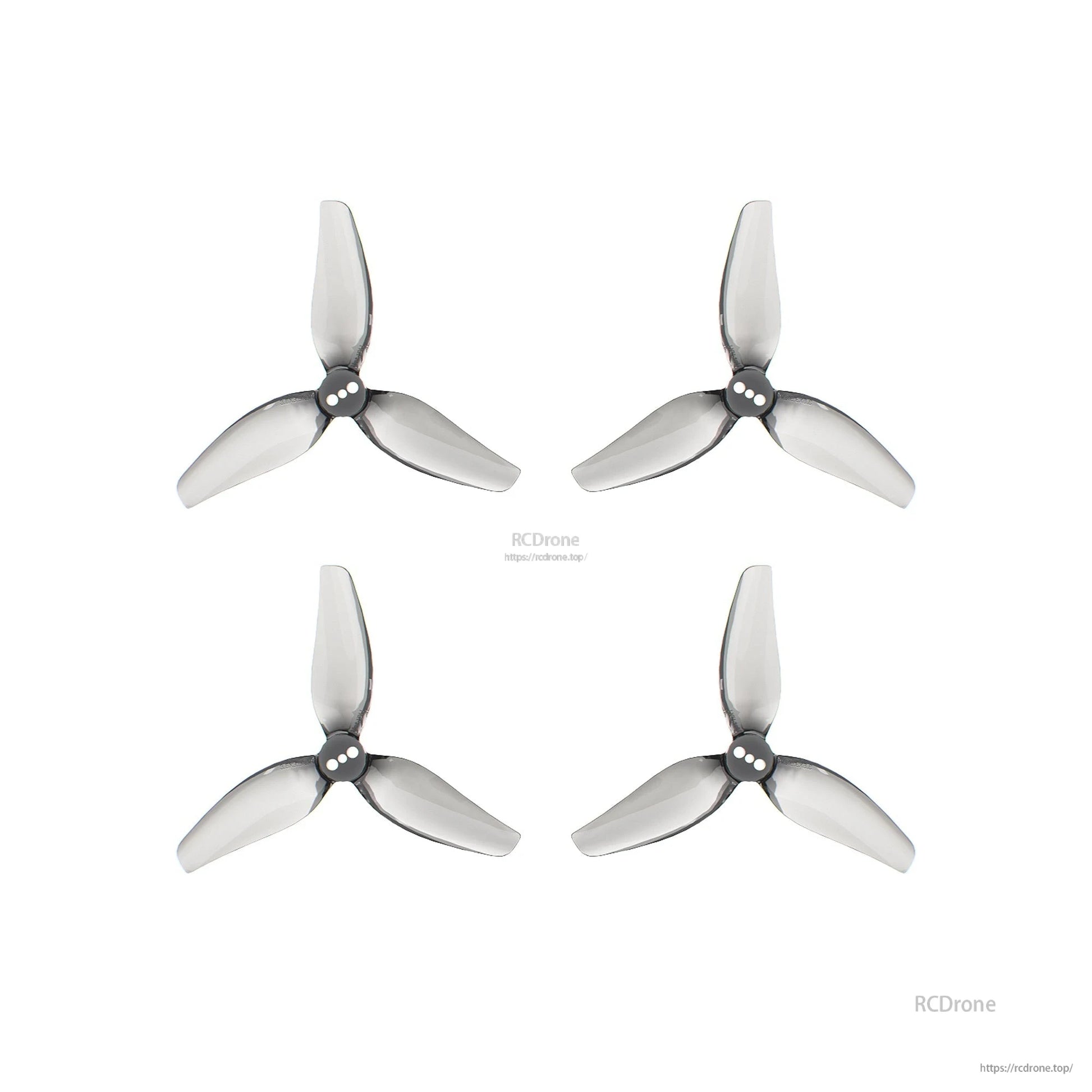 Four tri-blade propellers shown with RCDrone watermark and website URL on white background