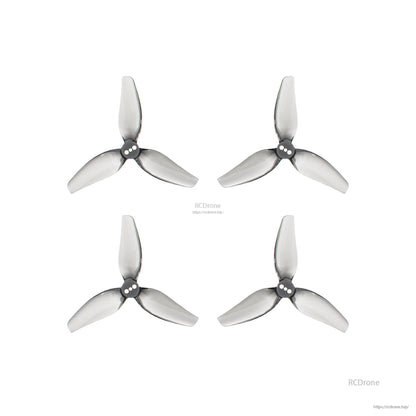 Four tri-blade propellers shown with RCDrone watermark and website URL on white background
