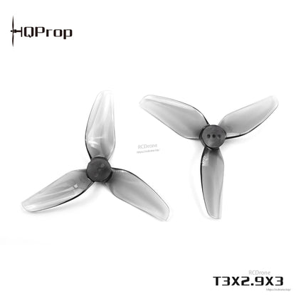 Angled view of two grey 3-blade drone propellers with three-hole hubs, T3X2.9X3 text