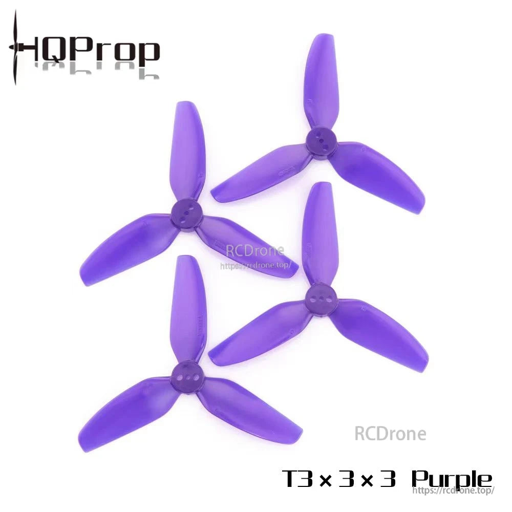 Four purple HQProp T3x3x3 tri-blade FPV drone propellers with a small center hub hole