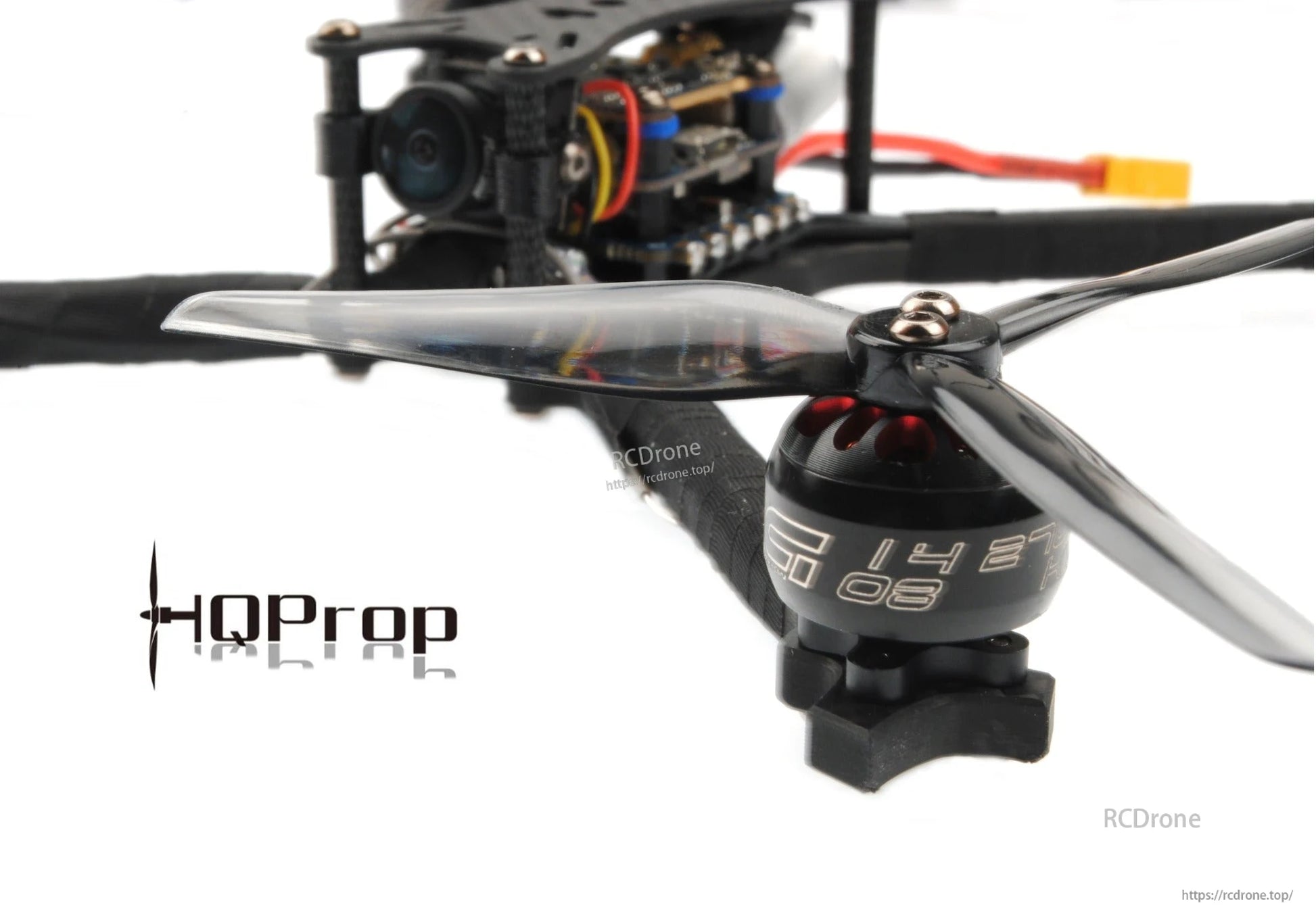 Side view close-up of propeller installed on drone motor, showing blade thickness and pitch