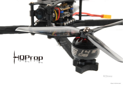 Side view close-up of propeller installed on drone motor, showing blade thickness and pitch