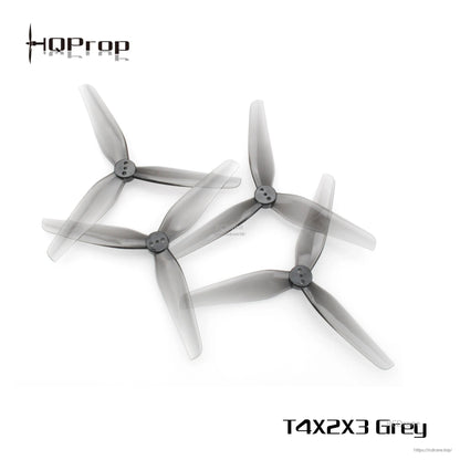 Grey 3-blade propellers overlapping, angled view showing blade profile and hub details