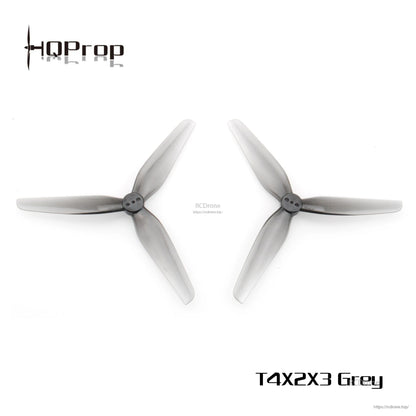 Two grey 3-blade propellers side by side, top-down comparison view