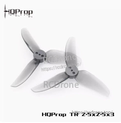 Grey tri-blade propeller pair angled view, close look at three-hole mounting hub design