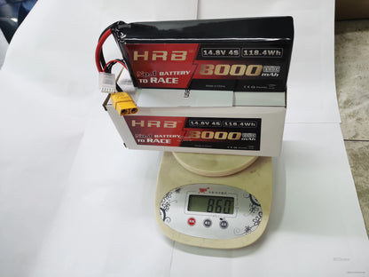 HRB 4S 14.8V 8000mAh LiPo battery and retail box on digital scale showing weight readout