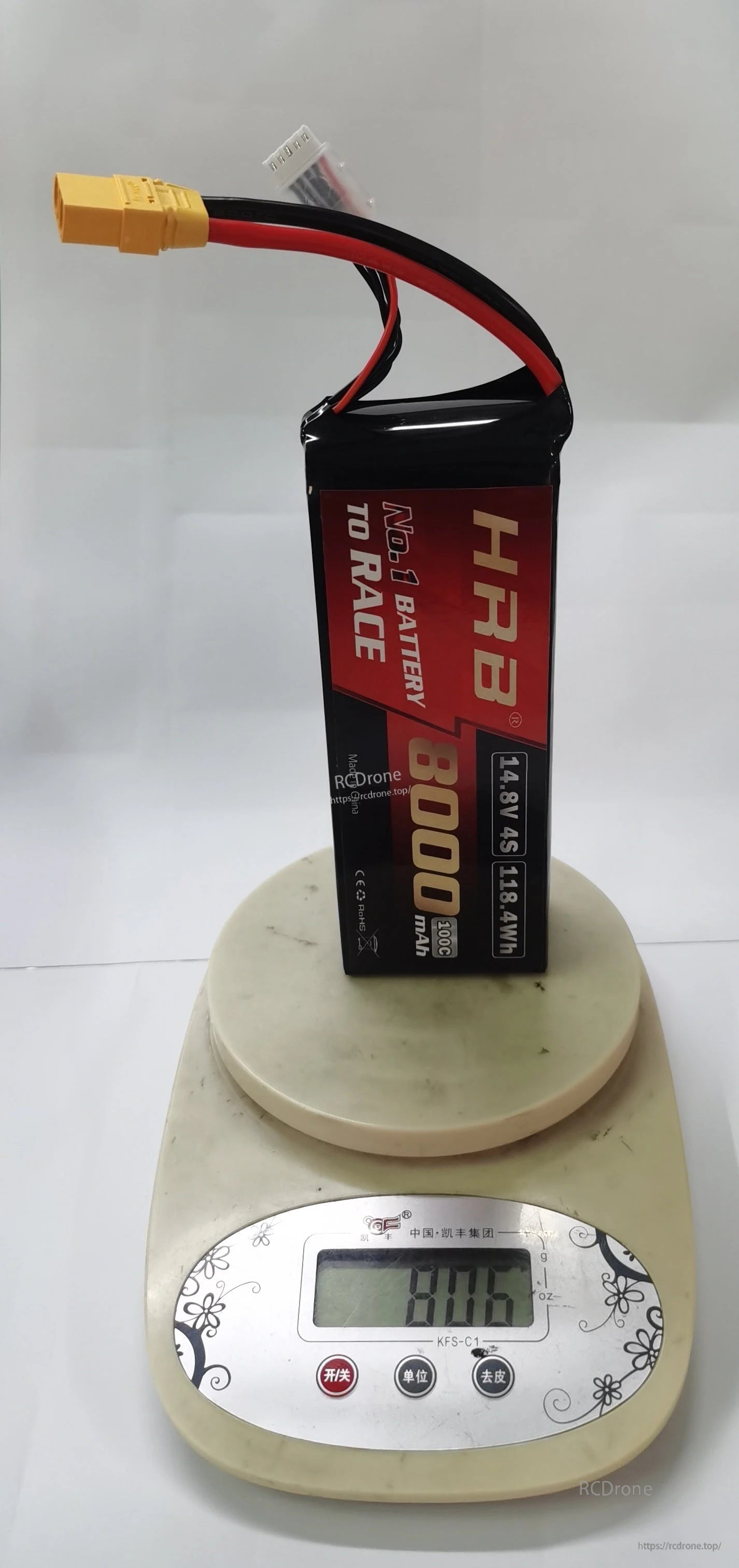 HRB 14.8V 4S 8000mAh LiPo battery on a digital scale showing approximate pack weight