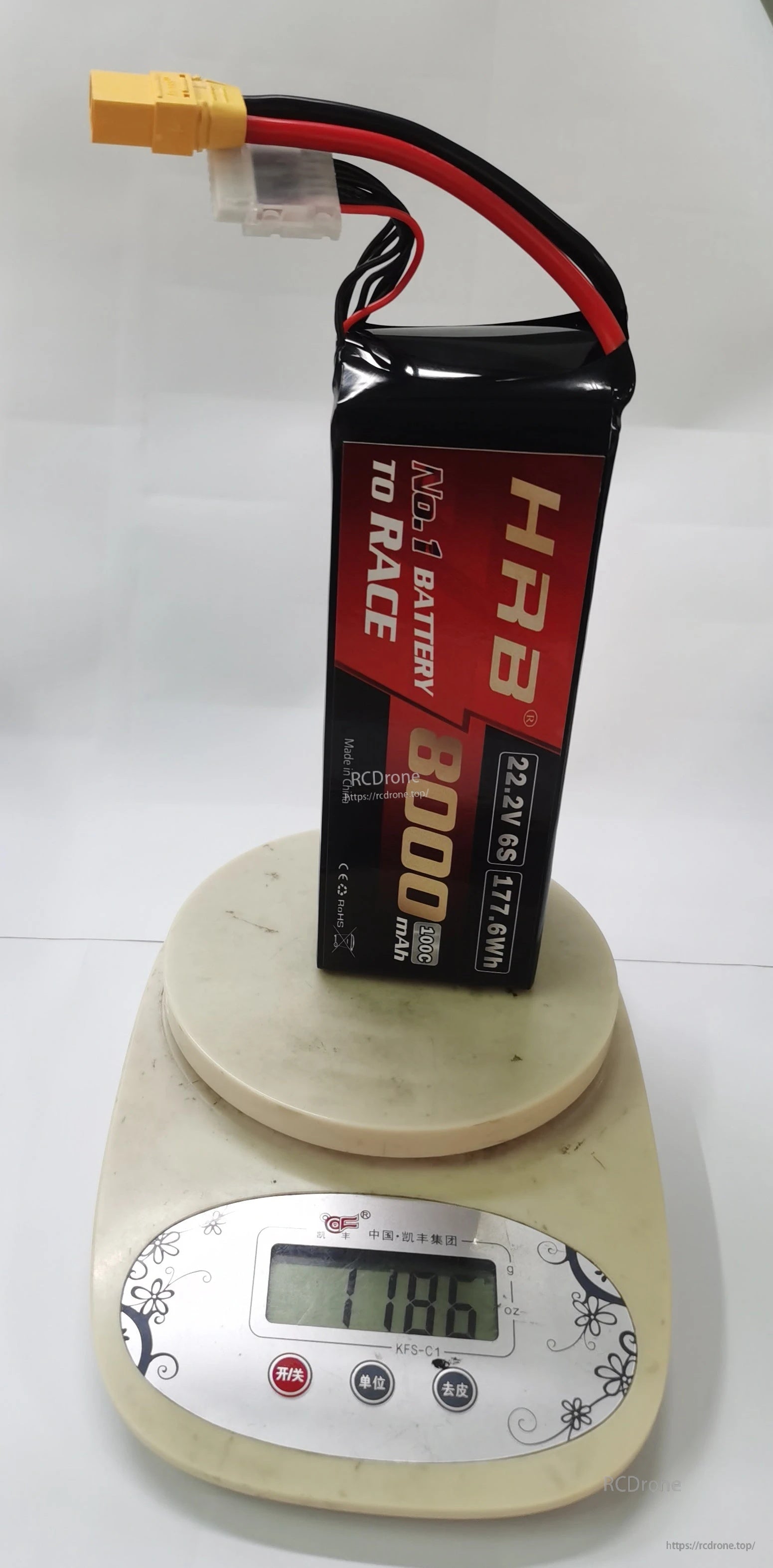 Side view of HRB 6S 8000mAh LiPo standing on a digital scale showing 1186 g