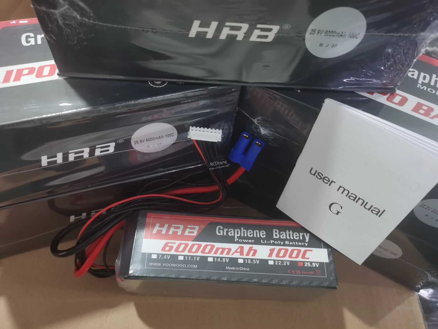 HRB Graphene LiPo battery package contents with retail boxes, EC5 connector lead, and user manual