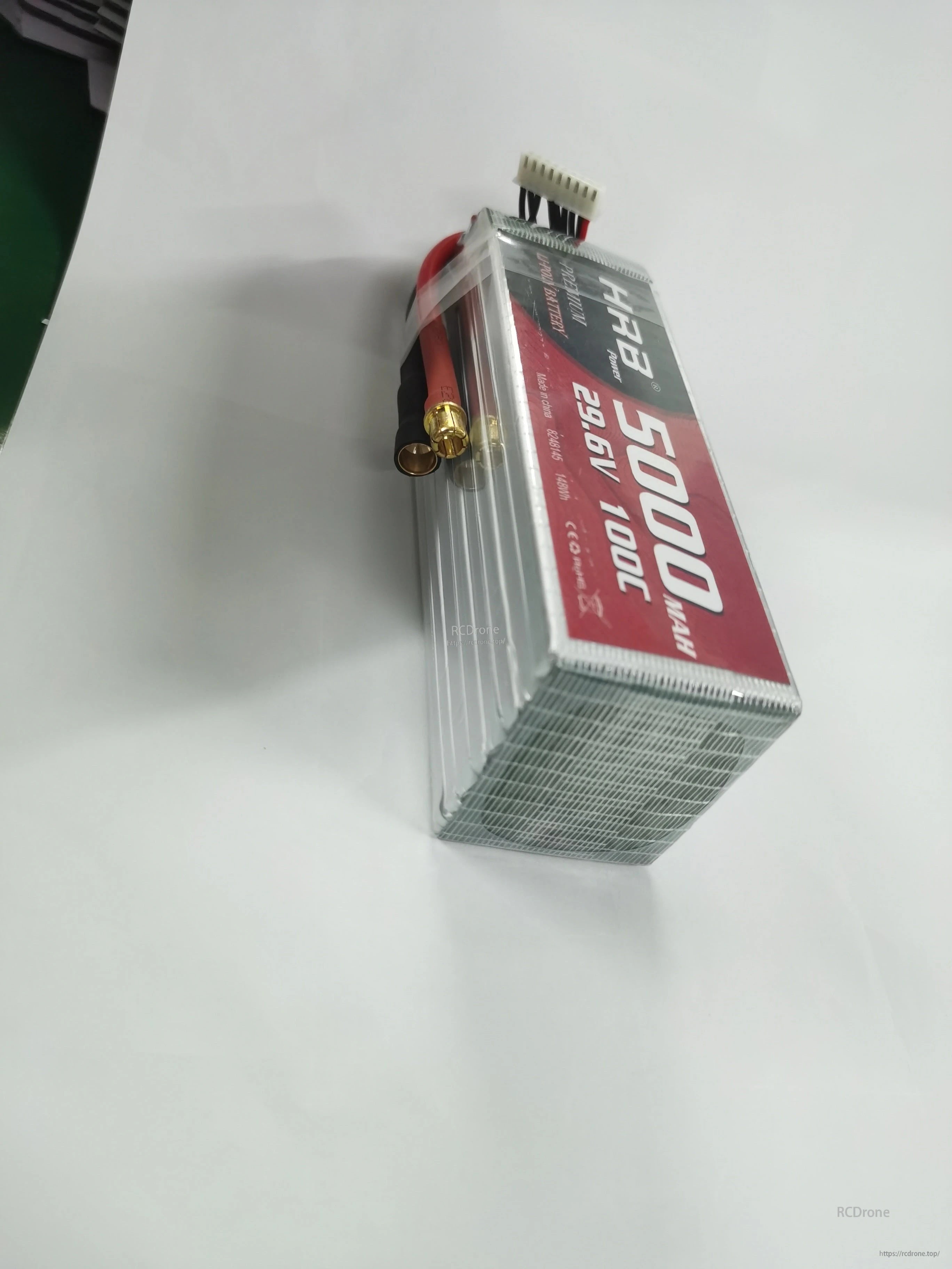 End angle of the LiPo pack highlighting the main power bullet connectors and multi-wire balance connector