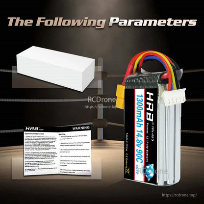 Package contents graphic with white box and warning instruction leaflet plus battery shown upright
