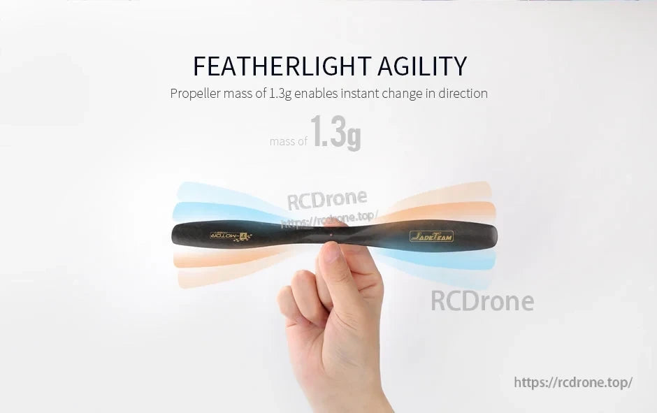 Hand holding a black T-Motor propeller with “Featherlight Agility” text and 1.3g mass shown