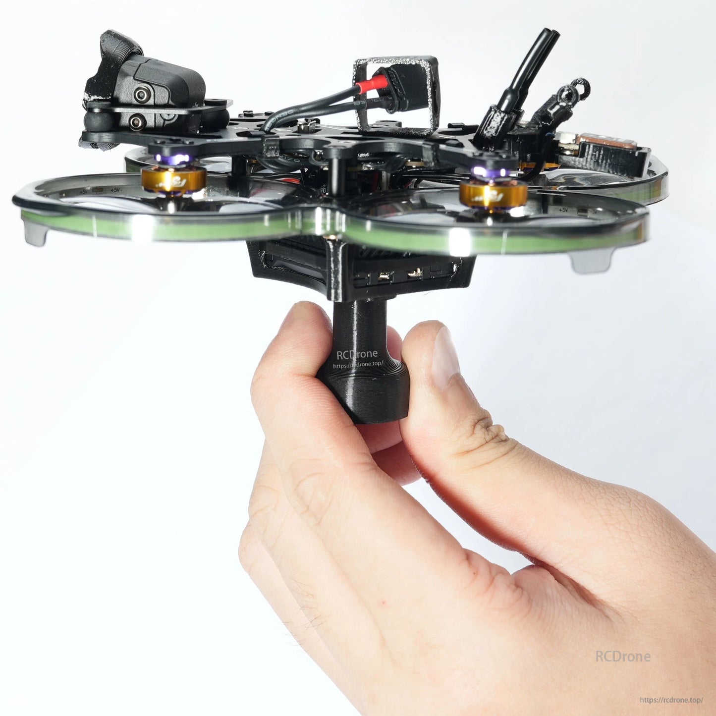 Handheld support TPU bracket handle mounted under a small FPV quadcopter frame for easier carrying and setup