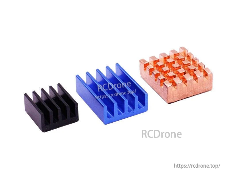 Set of three heatsinks: black and blue aluminum fin heatsinks plus copper heatsink block