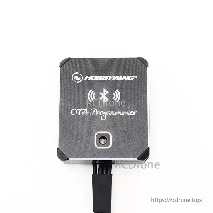 Hobbywing OTA Programmer module with Bluetooth symbol on black case and connected cable