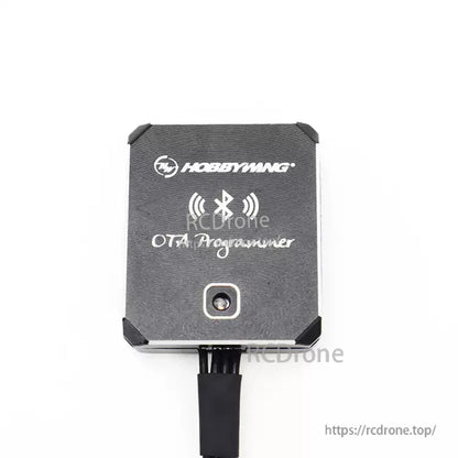 Hobbywing OTA Programmer module with Bluetooth symbol on black case and connected cable