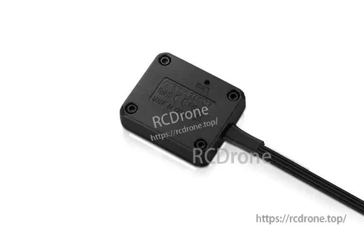 Hobbywing OTA programmer module with black rectangular case, four screws, and attached cable lead