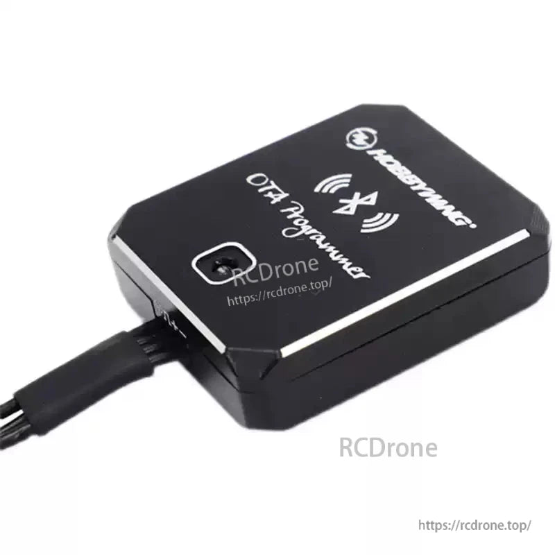 Hobbywing OTA Programmer module with Bluetooth icon on top and a wired connector plugged into the side