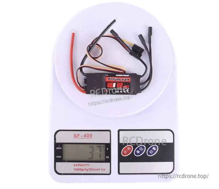 Hobbywing Skywalker 40A V2 RC aircraft ESC with attached power leads, motor wires, and receiver plug on a digital scale