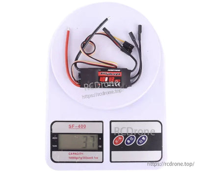 Hobbywing Skywalker 40A V2 RC aircraft ESC with attached power leads, motor wires, and receiver plug on a digital scale