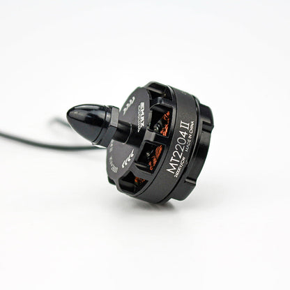 Single MT2204 II motor angled side view showing 2600KV label, exposed copper windings and wire lead