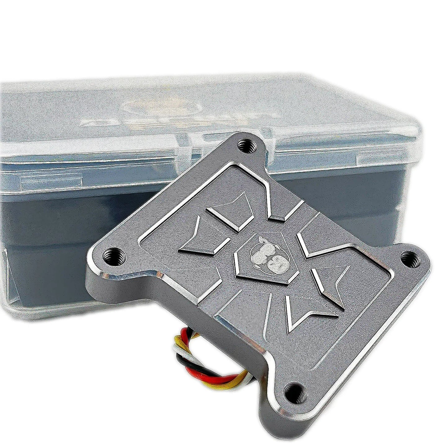 HULK FPV VTX underside plate with four mounting holes, shown in front of clear storage box