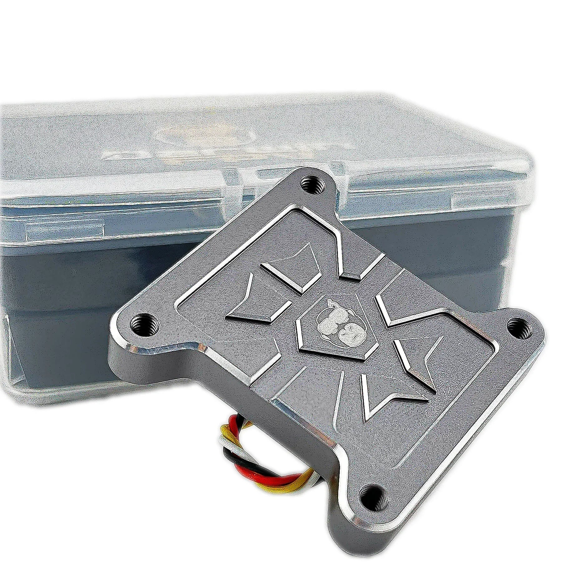 HULK FPV VTX underside plate with four mounting holes, shown in front of clear storage box