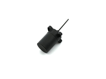 Compact black helical GNSS antenna angled view showing mounting base and cable exit