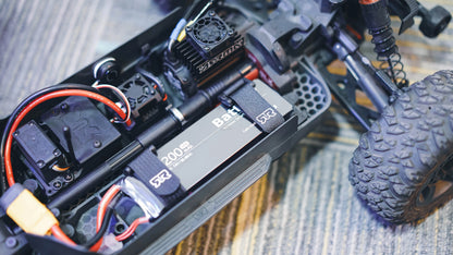 ISDT BattAir 2S 5200mAh 80C Smart RC LiPo Battery, ISDT BattAir smart RC LiPo battery installed in an RC car battery tray with strap and power leads connected
