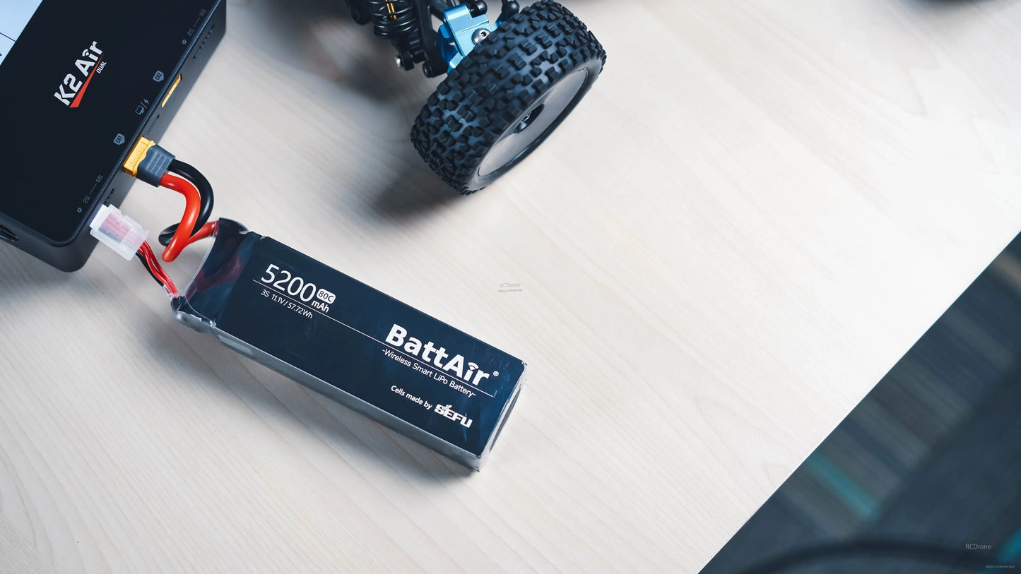 ISDT BattAir 3S 5200mAh 80C Smart LiPo Battery, ISDT BattAir 3S 5200mAh 80C LiPo battery with XT60 and balance lead connected to a charger on a workbench