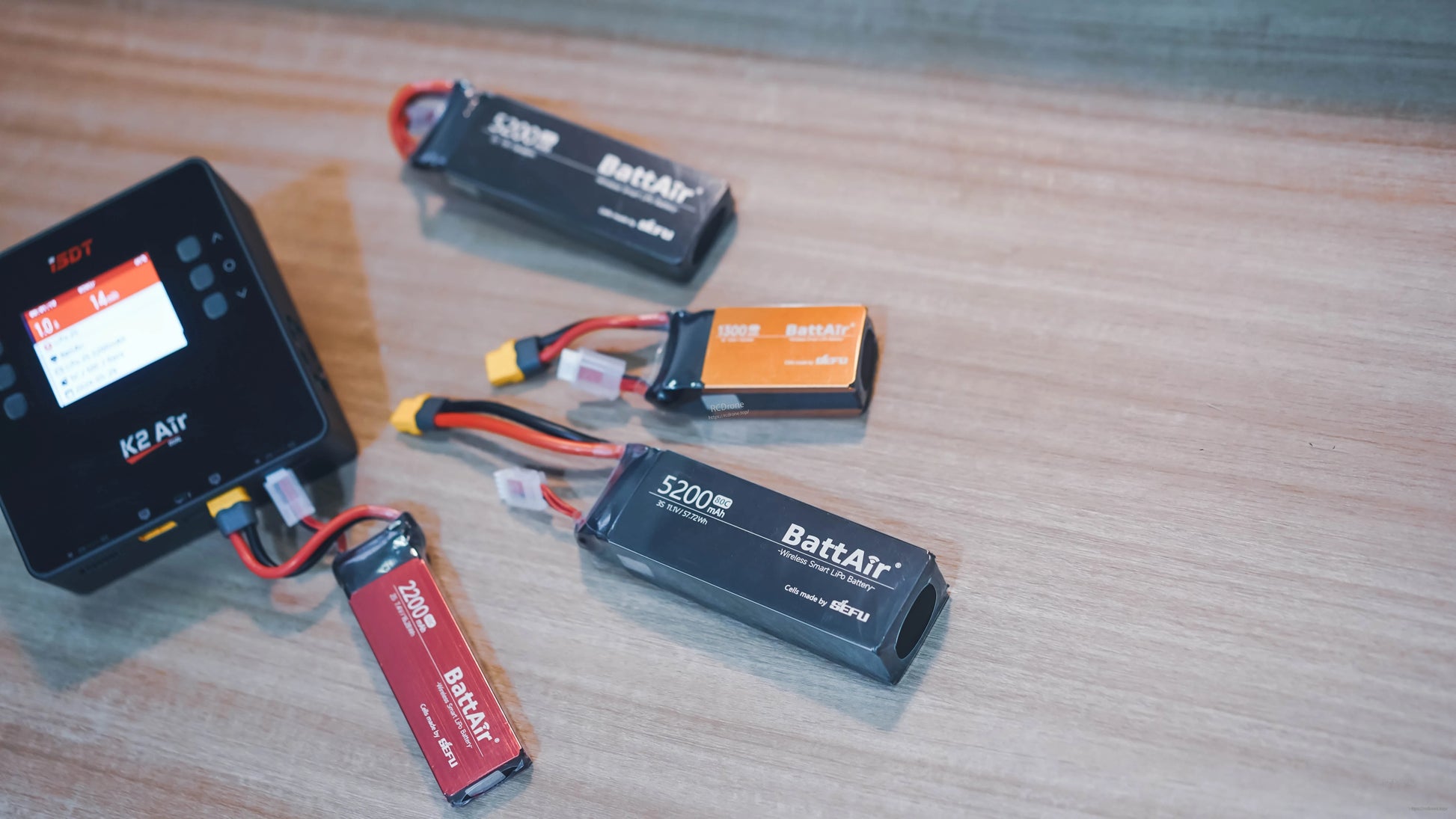ISDT BattAir 3S 5200mAh 80C smart LiPo battery with XT60 main lead and balance plug on a bench