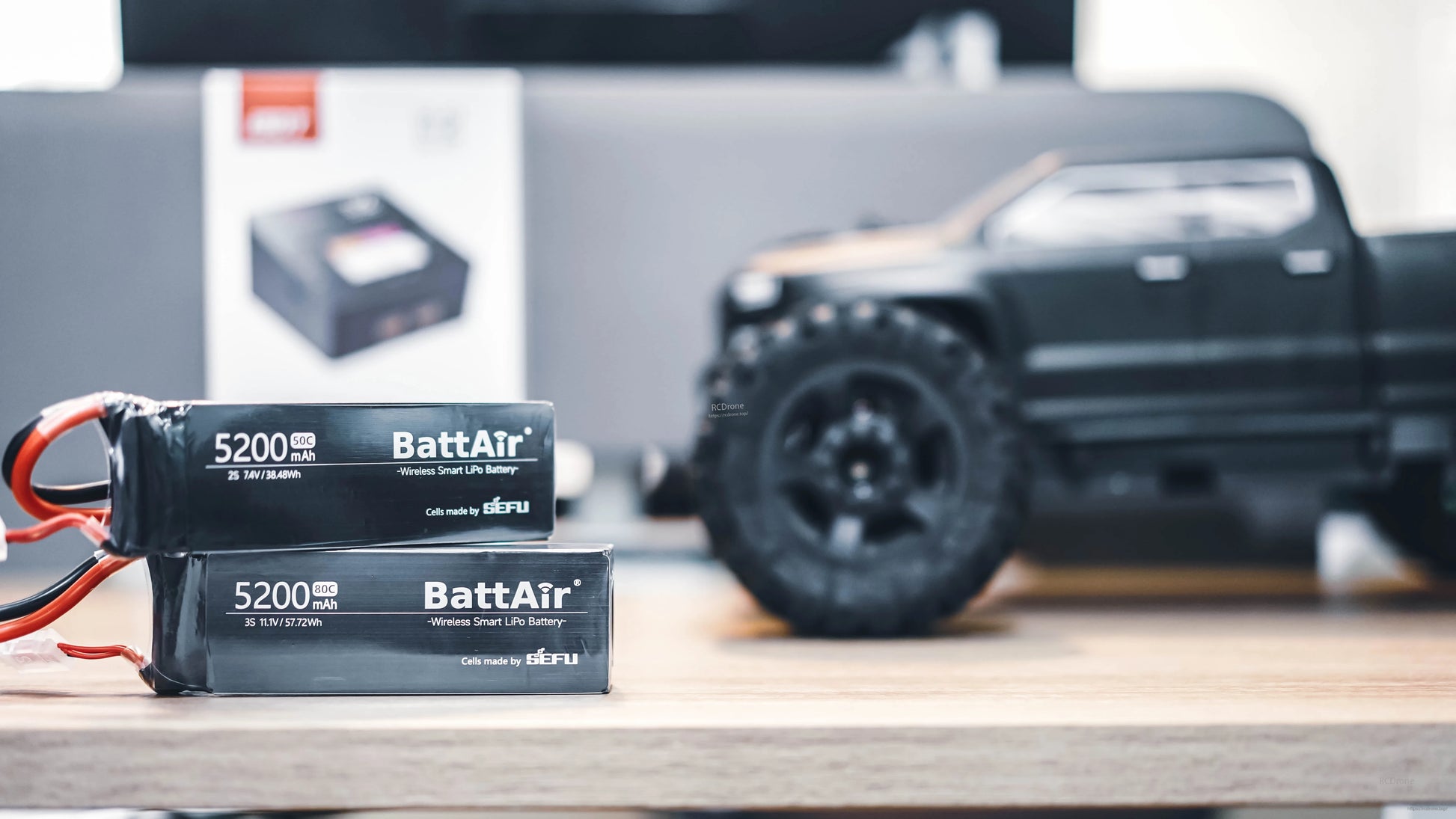 ISDT BattAir Smart RC LiPo Battery, Two ISDT BattAir wireless smart LiPo RC batteries, 5200mAh packs labeled 2S 7.4V and 3S 11.1V.
