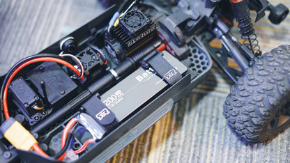ISDT BattAir smart RC LiPo battery pack in an RC car chassis, 2000mAh 50C pack secured with straps