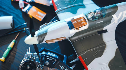ISDT BattAir smart RC LiPo battery pack installed in a model airplane battery bay during setup