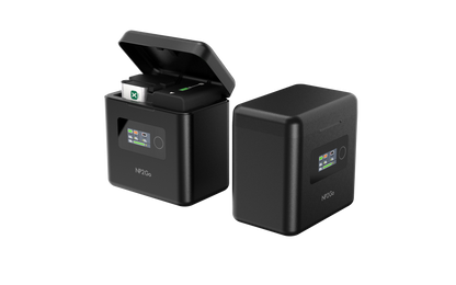 ISDT NP2GO 4-channel camera battery charger with flip-top lid and front color screen showing charge status